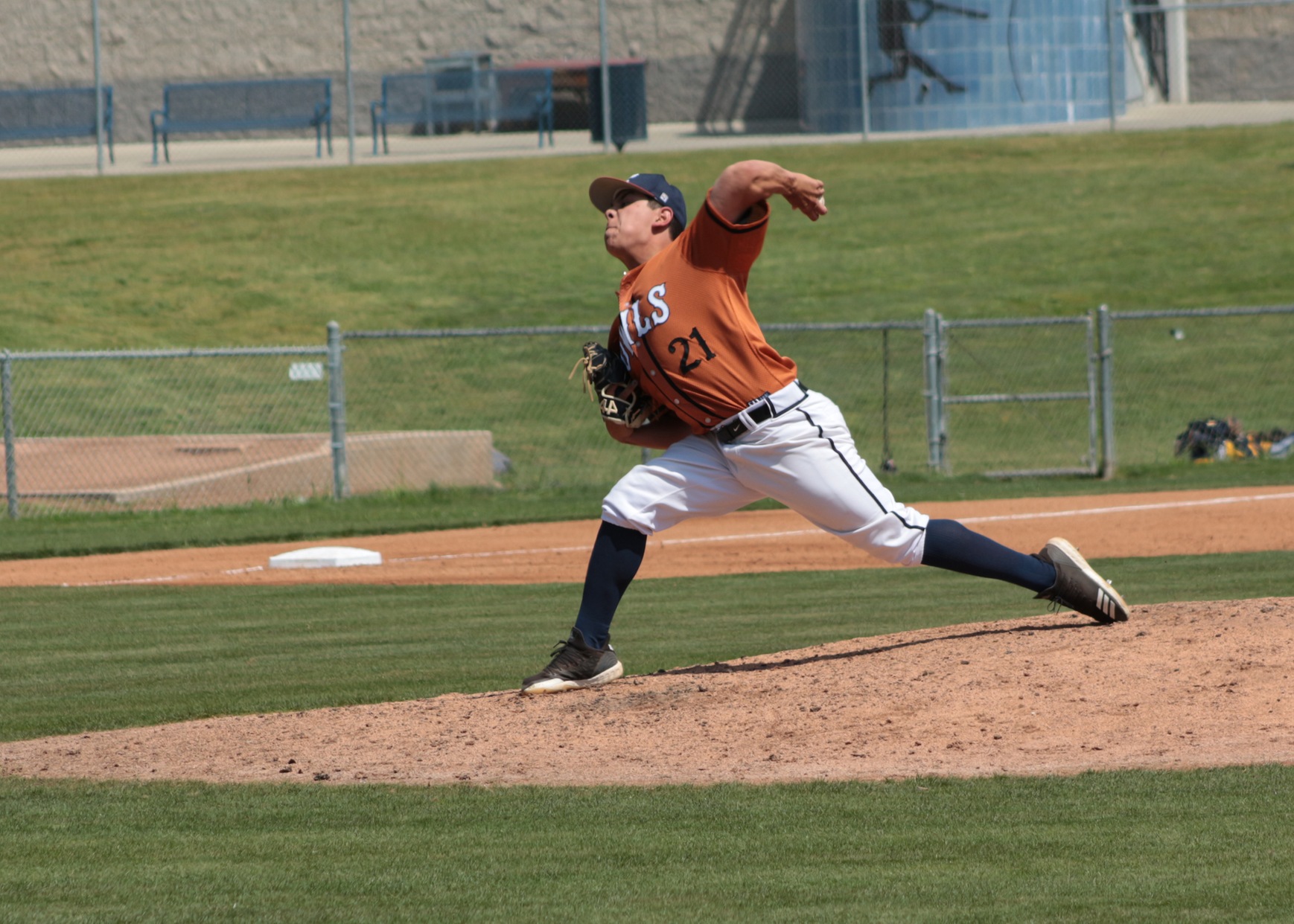 Slinger Samuel Gomez delivers from the mound. Image: Ayla Ahmed