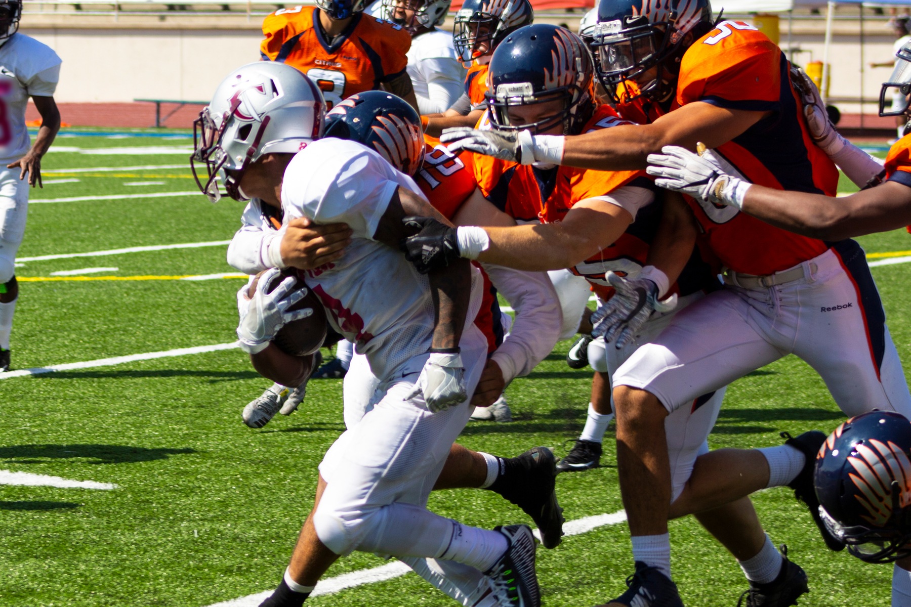 A trio of Owl defenders converge. Image: Treyvon Watts-Hale