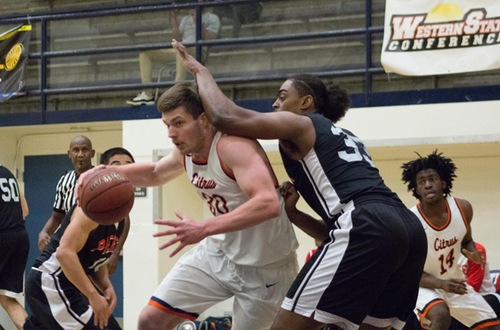 Quintin Bailey hammers on the low post. Photo credit: Semaj Shepheard