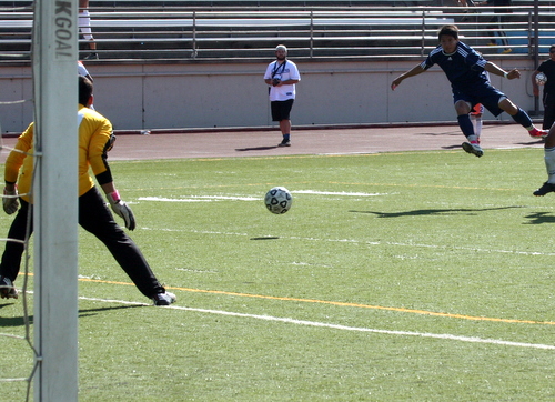 Freshman Grayson Iwasaki (pictured far right in navy) scored the third goal of his hat trick on this shot from 10 yards out.