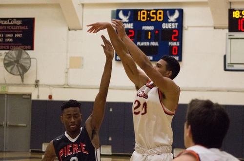 Kyle Gray knocks down a jumper over LA Pierce. Photo credit: Semaj Shepheard