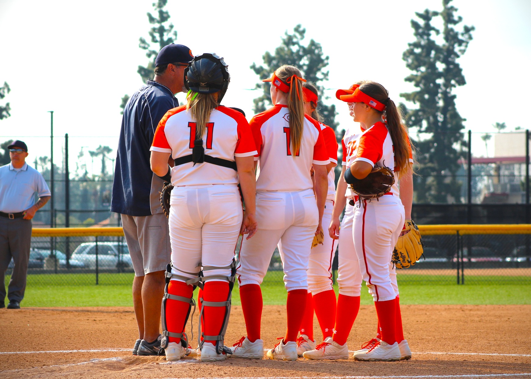 Head Coach Terry Paredez discusses strategy with his players. Image: Treyvon Watts-Hale